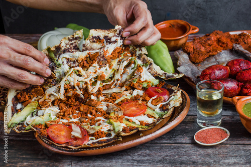 Tlayuda and oaxaca cheese in half traditional Mexican food from Oaxaca Mexico