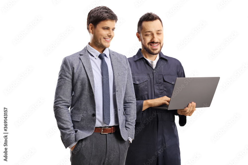 Auto mechanic with a laptop presenting to a male customer Auto mechanic with a laptop presenting to a male customer