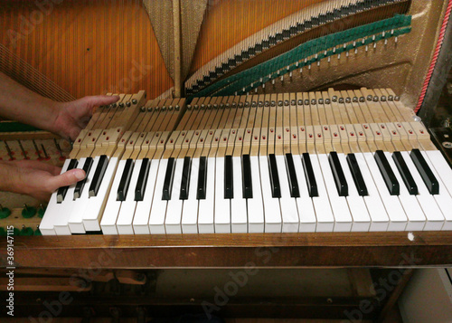 piano tuning, repairing and cleaning the vintage piano