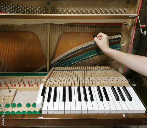 piano tuning, repairing and cleaning the vintage piano