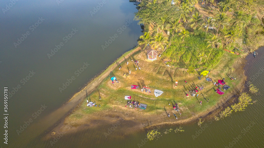 Aerial view, camp on the edge of a Sermo reservoir during the dry season in the morning.