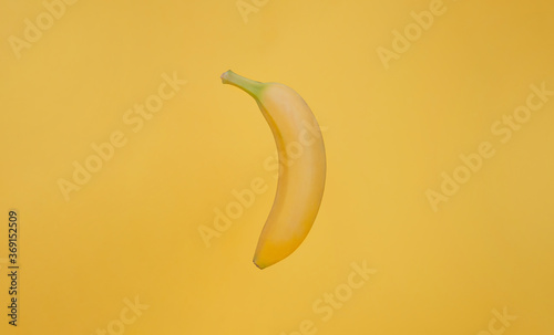 Banana isolated on yellow background