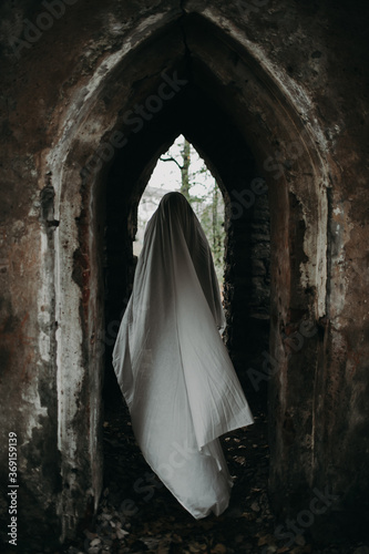 Ghost moving in arch of abandoned building photo