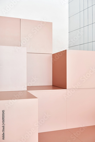 Peach-colored cubes in room near white wall