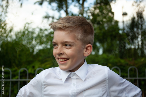 Boy smiles.