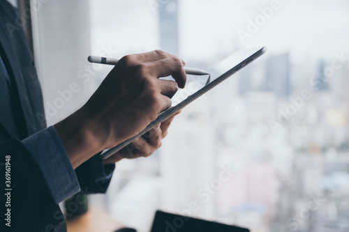 business man working with tablet with the background of city