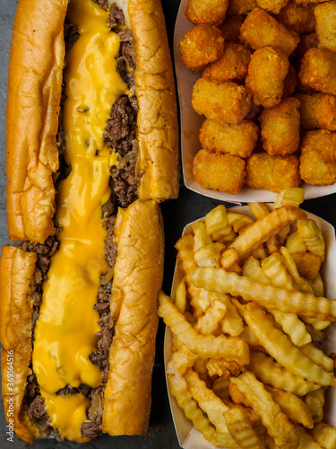 Cheesesteak with French fries and tater tots