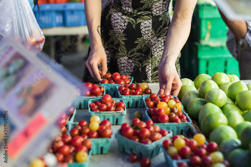 Woman buying vegetables at the market