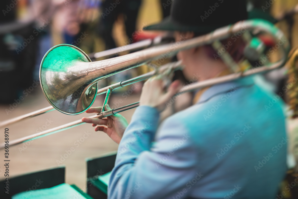 Fototapeta premium Concert view of a trombone player trombonist with musical jazz band performing