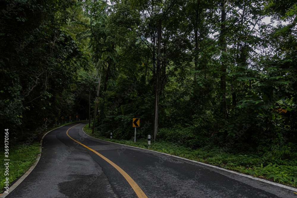 Rural Country Road on the Mountains early in the morning on the Doi Phuka National Reserved Park, Nan Province, Thailand Rural Country Road on the Mountains early in the morning on the Doi Phuka National Reserved Park, Nan Province, Thailand
