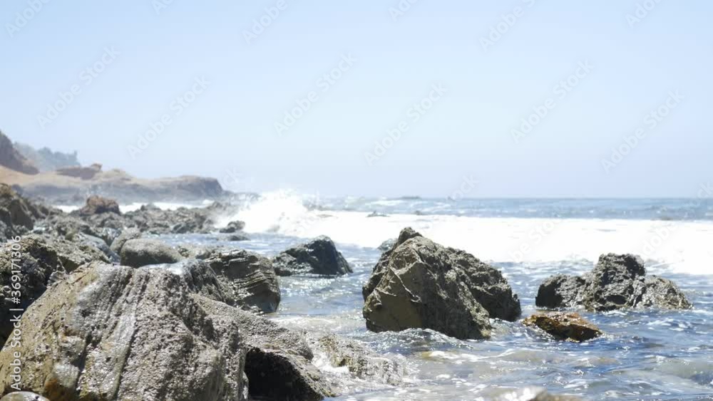 The ocean crashes among the rocks on the California coast. The ocean crashes among the rocks on the California coast.