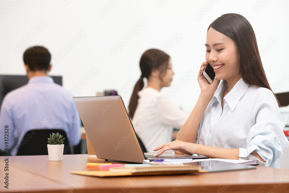 Business asian woman happy working job on laptop in office. Business asian woman happy working job on laptop in office.