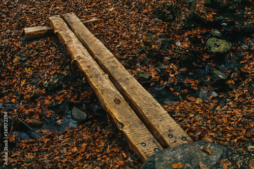 A Small Wooden Bridge Used to Cross a Creek
