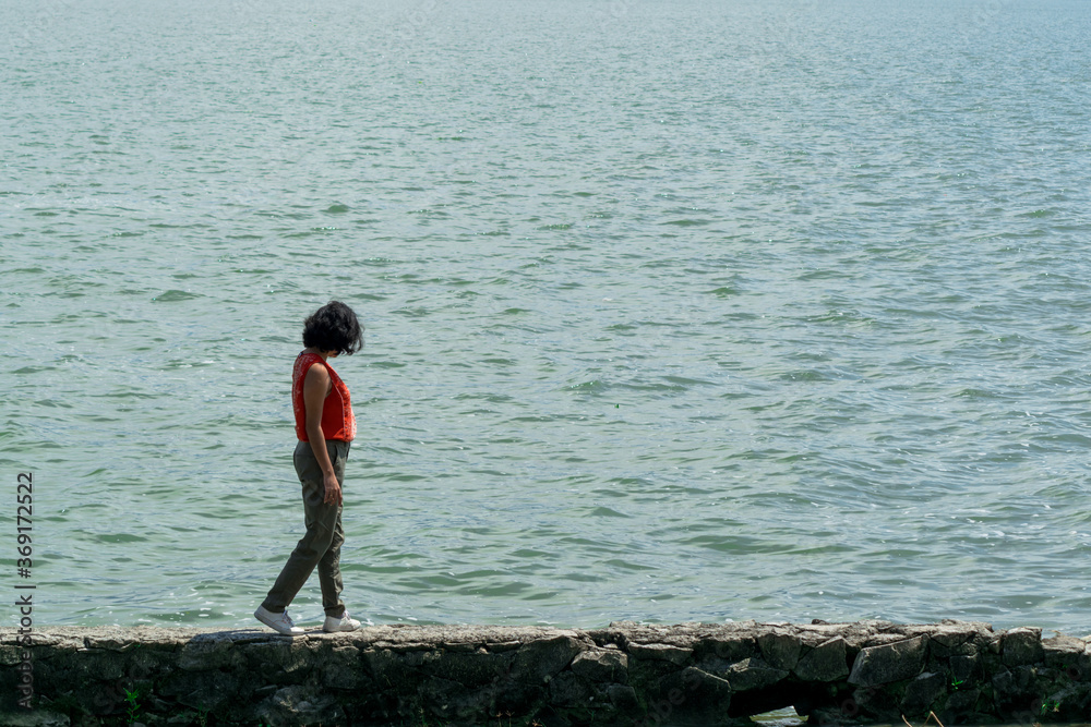 Girl walking on the lagoon
