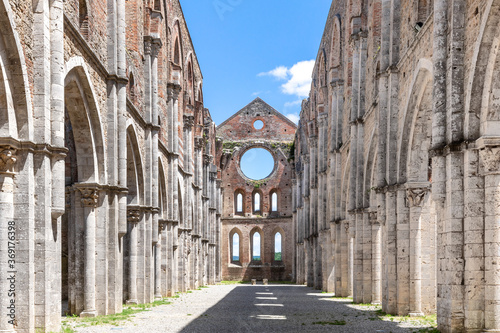 Wallpaper Mural Symmetrical view of the main nave of an ancient cathedral in ruins and with no roof, under a blue summer sky Torontodigital.ca