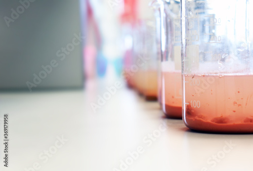 Waste water sample in beakers coagulation and flocculation method with Ferric chlorine and using Jar test for forming precipitation and reduced turbidity calibration range. Use for science background. photo