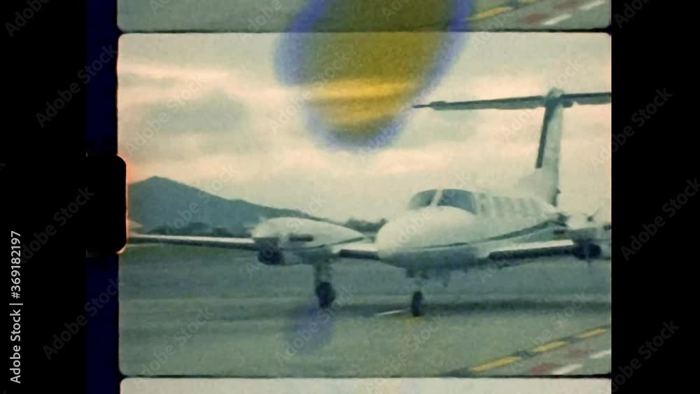 Real Vintage Super-8 Footage of a Bimotor Airplane in the Airport Runway. Shoot in Kodak Vision3 T500.