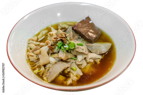 Top view Duck noodle soup on a white bowl, focus selective