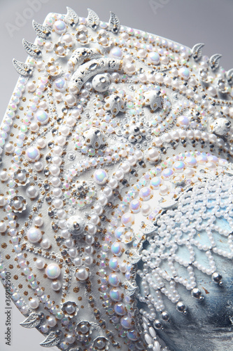Head of mannequin in creative white kokoshnick with jewels and pearls
