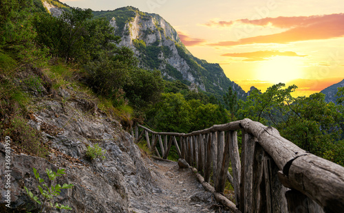 Beautiful sunset over Mount Olympus in Greece. This is the small road to Enipea source of the river Zeus Bath near the village of Litochoro photo