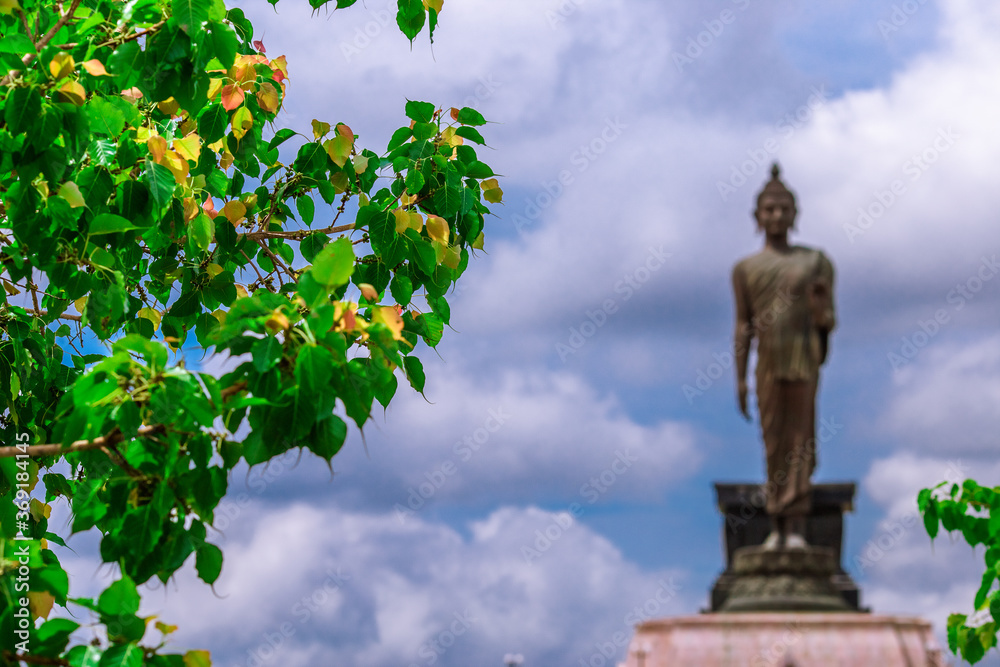 Fototapeta premium Phutthamonthon Isan-Khon Kaen:16 June2020,Atmosphere within the religious tourist attraction,There is a large Buddha statue looming on the bypass road,allowing citizens or tourists to make merit ,thai