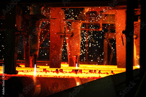 Steel billets at torch cutting in metallurgical plant. Metallurgical production  heavy industry  engineering  steelmaking