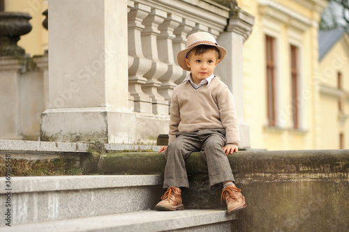 Little, sweet boy wearing a hat, outdoor.