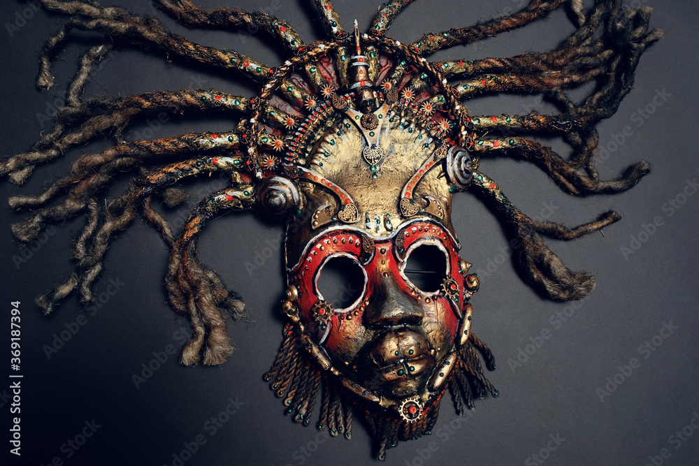 Creative african mask, dark studio background - obrazy, fototapety, plakaty 