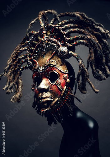 Creative african mask, dark studio background