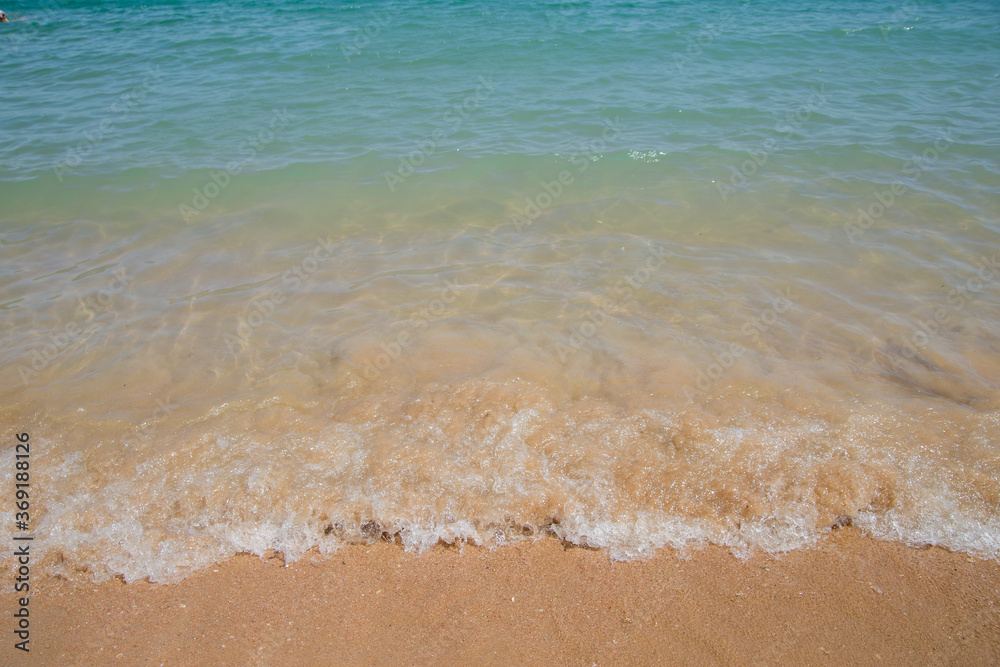 clear azure water on the beach with sand