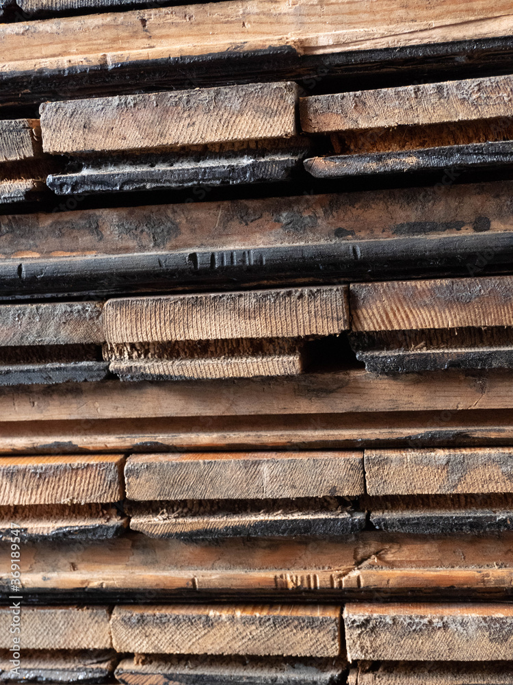 Stacks of reclaimed Parquet flooring.