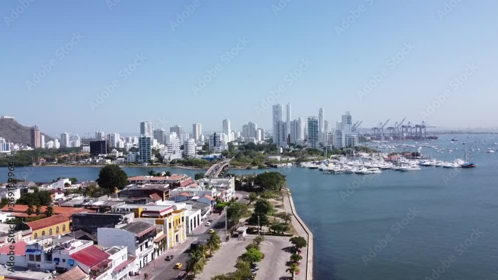 Rising drone shot of skyscrapers and ports / harbour in the Caribbean Sea. Cartagena, Colombia. Rising drone shot of skyscrapers and ports / harbour in the Caribbean Sea. Cartagena, Colombia.