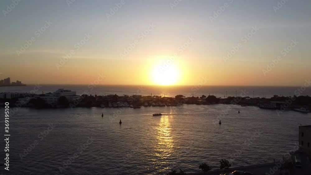 Rising drone shot of the Caribbean sea near at sunset. Taken from Cartagena, Colombia. Rising drone shot of the Caribbean sea near at sunset. Taken from Cartagena, Colombia.