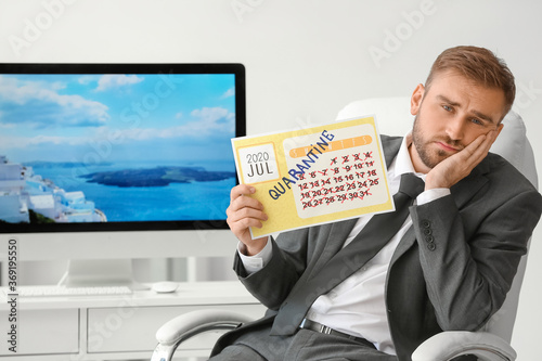 Sad businessman with calend...