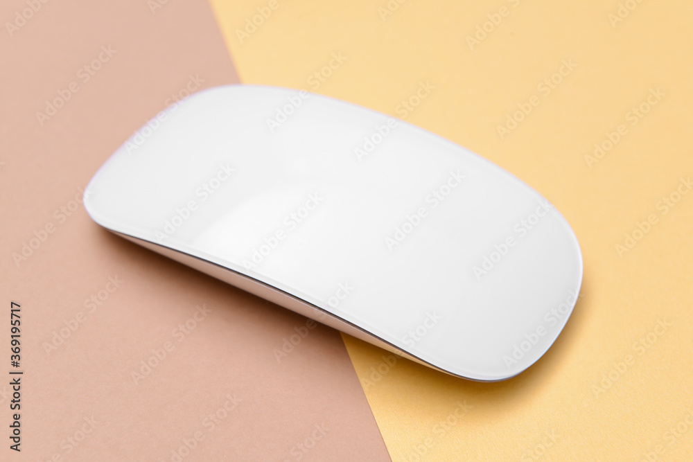 Modern computer mouse on color background