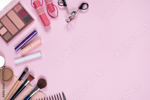 Fototapeta Naklejka Na Ścianę i Meble -  Top view of cosmetics on pink background