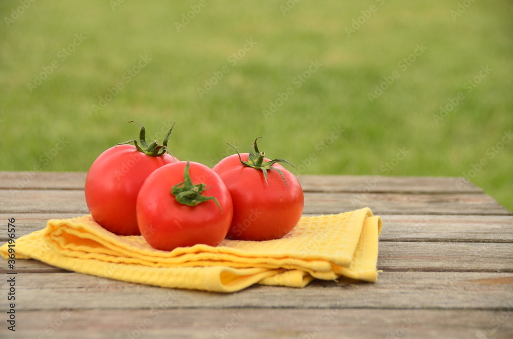 fresh tomatoes on a wooden table fresh tomatoes on a wooden table