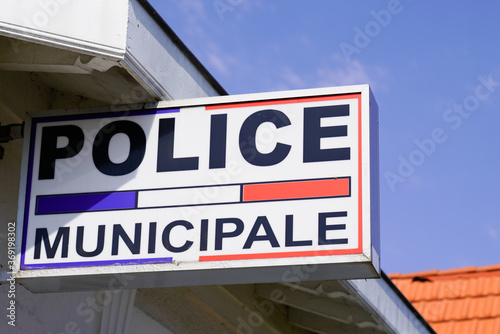 police municipale means in french Municipal police Station with flag and text sign © OceanProd