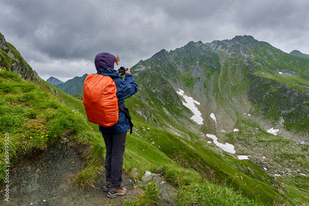 Fototapeta premium Nature photographer shooting in the highlands