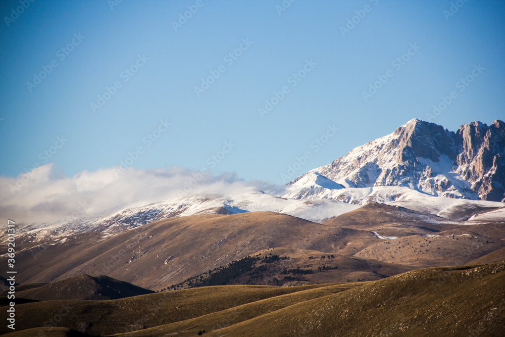 Beautiful snow capped mountains in the Italian countryside Beautiful snow capped mountains in the Italian countryside