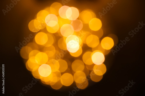 Gold bokeh sparkle night light bulb abstract background