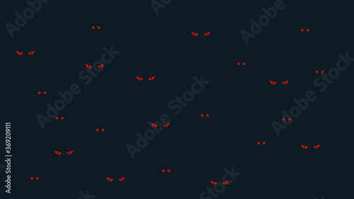 Scary evil eyes in the dark background. Red eyes of monsters on black background. Halloween concept