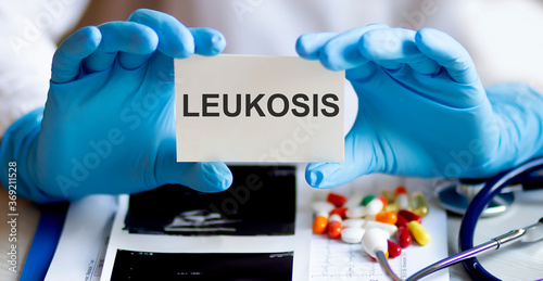 text LEUKOSIS write on a medicine card. Medical concept with a stethoscope and pills