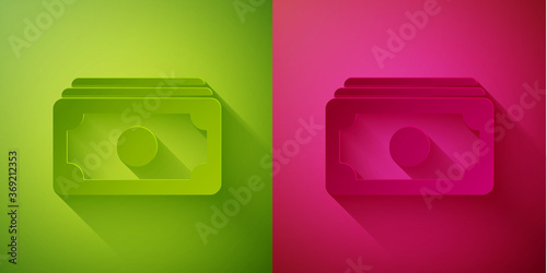 Paper cut Stacks paper money cash icon isolated on green and pink background. Money banknotes stacks. Bill currency. Paper art style. Vector Illustration.