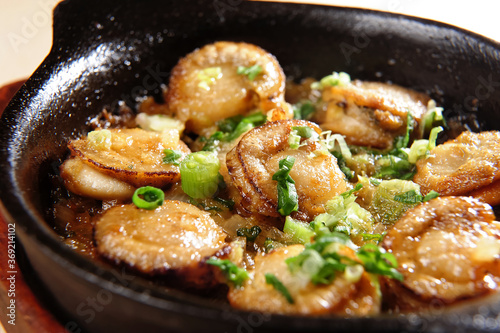 A Pot Of Baked Scallops In Garlic Oil