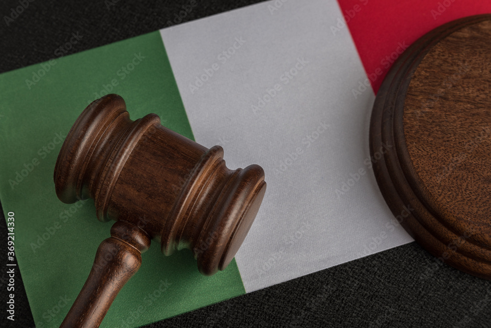 Judge gavel on Italian flag. Law and justice. Close up