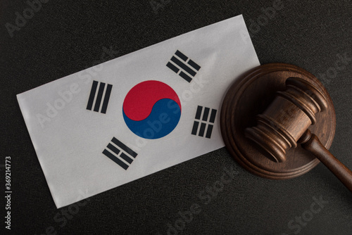 Justice mallet and South Korea flag. Protection of human rights. Legality concept photo