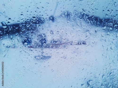 Natural water drop texture on the window glass