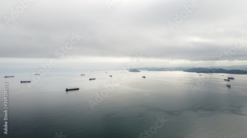 Trade ships on anchor at a harbour in Russia