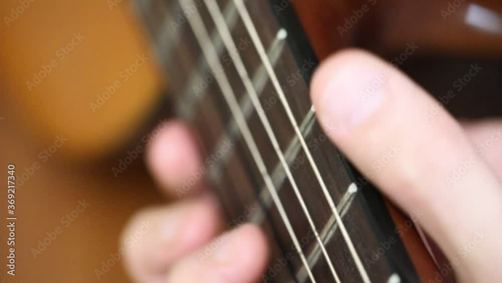 playing guitar close-up busting strings and fingers playing guitar close-up busting strings and fingers
